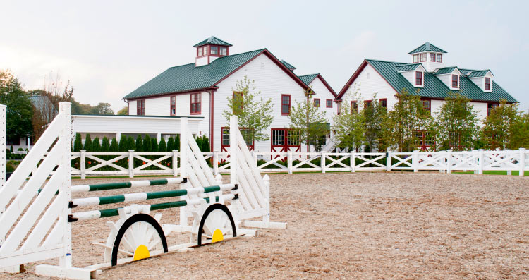 Horse Jumps beside Large Scale Equestion Facility Architecture