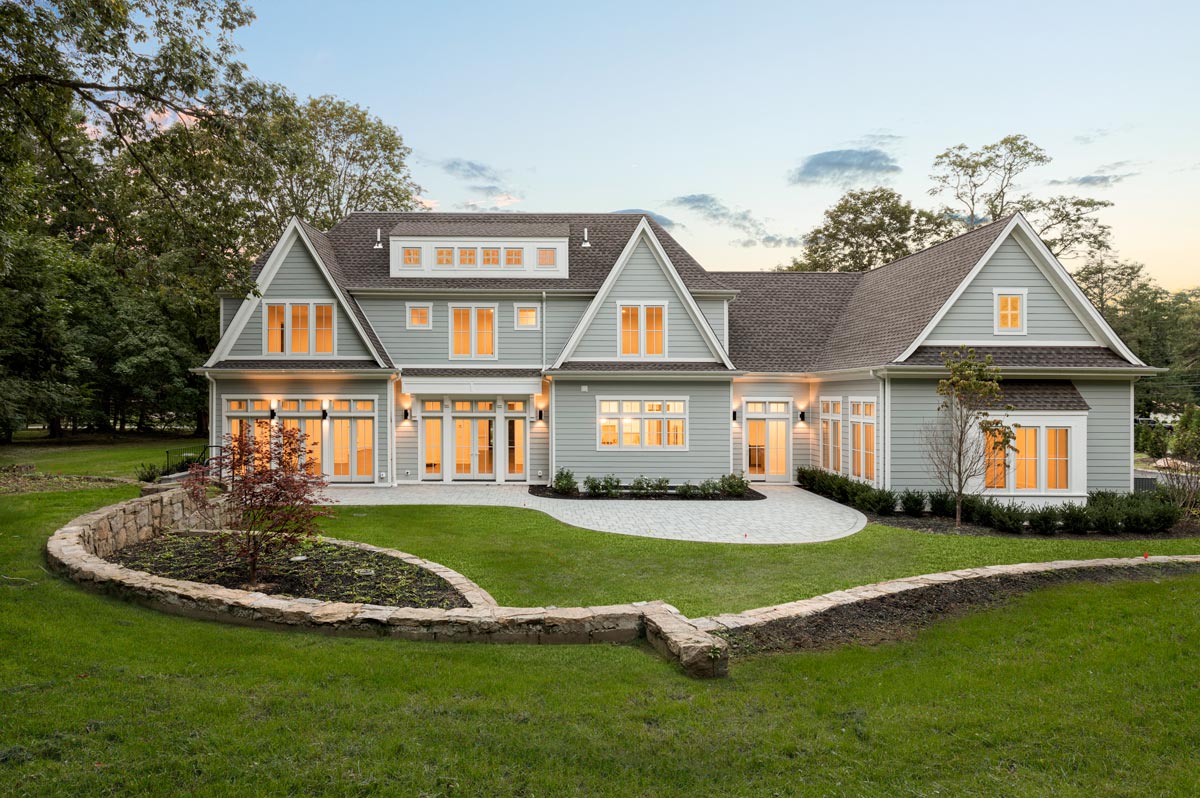 Long Island Custom Home Architecture Rear Yard Elevation at Dusk