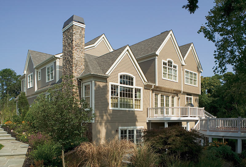 Stepped Patio and Rear Deck Balcony with Traditional Architecture Aesthetic